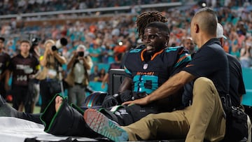 Sep 29, 2025; Miami Gardens, Florida, USA; Miami Dolphins wide receiver Tyreek Hill (10) reacts after being placed on a medical cart against the New York Jets during the second half at Hard Rock Stadium. Mandatory Credit: Sam Navarro-Imagn Images