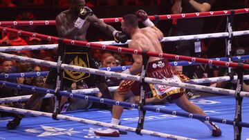 US' Deontay Wilder (L) competes with New Zealand's Joseph Parker during their heavyweight boxing match at the Kingdom Arena in Riyadh on December 23, 2023. (Photo by Fayez NURELDINE / AFP)