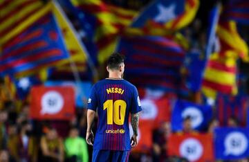 BARCELONA, SPAIN - SEPTEMBER 19: Lionel Messi of FC Barcelona looks on as Catalan Pro-Independence flags are seen on the background during the La Liga match between Barcelona and SD Eibar at Camp Nou on September 19, 2017 in Barcelona, Spain. (Photo by Da