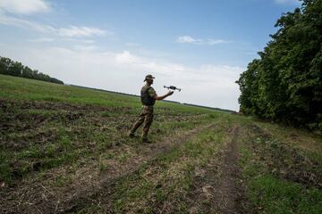 Ukrainian servicemen train using commercial drones in a military capacity