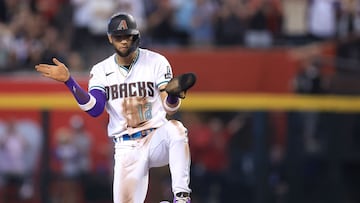 PHOENIX, ARIZONA - OCTOBER 19: Lourdes Gurriel Jr. #12 of the Arizona Diamondbacks celebrates after stealing second base against Trea Turner #7 of the Philadelphia Phillies during the ninth inning in Game Three of the National League Championship Series at Chase Field on October 19, 2023 in Phoenix, Arizona.   Sean M. Haffey/Getty Images/AFP (Photo by Sean M. Haffey / GETTY IMAGES NORTH AMERICA / Getty Images via AFP)