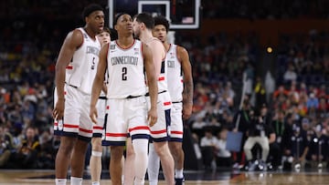 INDIANAPOLIS, INDIANA - APRIL 04: Silas Demary Jr. #2 of the UConn Huskies and Tarris Reed Jr. #5 of the UConn Huskies look on during the second half against the Illinois Fighting Illini in the Final Four of the 2026 NCAA Men's Basketball Tournament at Lucas Oil Stadium on April 04, 2026 in Indianapolis, Indiana. Michael Reaves/Getty Images/AFP (Photo by Michael Reaves / GETTY IMAGES NORTH AMERICA / Getty Images via AFP)