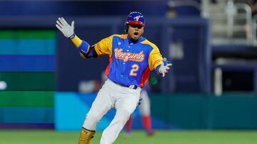 Mar 11, 2023; Miami, Florida, USA; Venezuela first baseman Luis Arraez (2) reacts from second base after hitting a double during the first inning against the Dominican Republic at LoanDepot Park. Mandatory Credit: Sam Navarro-USA TODAY Sports