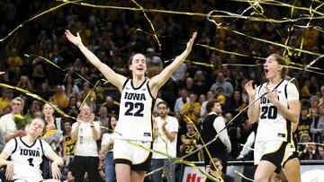 IOWA CITY, IOWA- MARCH 3: Guard Caitlin Clark #22 and guard Kate Martin #20 of the Iowa Hawkeyes celebrates in the confetti after senior day festivities after the match-up against the Ohio State Buckeyes at Carver-Hawkeye Arena on March 3, 2024 in Iowa City, Iowa.   Matthew Holst/Getty Images/AFP (Photo by Matthew Holst / GETTY IMAGES NORTH AMERICA / Getty Images via AFP)