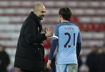 Manchester City manager Pep Guardiola with David Silva after the match