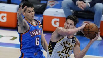 Indiana Pacers forward Doug McDermott (20) passes in front of Oklahoma City Thunder forward Gabriel Deck (6) in the second half of an NBA basketball game Saturday, May 1, 2021, in Oklahoma City. (AP Photo/Sue Ogrocki)