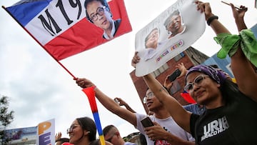 Supporters of presidential candidate of the Historical Pact coalition, Gustavo Petro, celebrate after he won a runoff presidential election in Cali, Colombia, Sunday, June 19, 2022. (AP Photo/Andres Quintero)