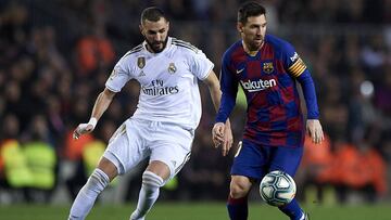 BARCELONA, SPAIN - DECEMBER 18: Lionel Messi (R) of Barcelona competes for the ball with Karim Benzema of Real Madrid during the Liga match between FC Barcelona and Real Madrid CF at Camp Nou on December 18, 2019 in Barcelona, Spain. (Photo by Pablo Moran