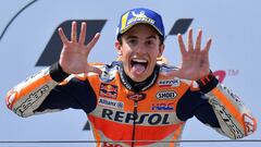 TOPSHOT - Repsol Honda Team's Spanish rider Marc Marquez shows the number 10 with his hands (the number of his victories) as he celebrates on the podium after winning the Moto GP Grand Prix Germany at the Sachsenring Circuit on July 7, 2019 in Hohenstein-