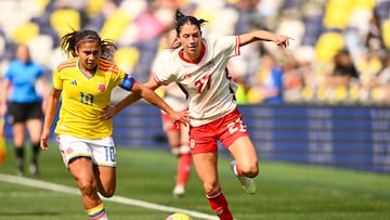 Mar 1, 2026; Nashville, Tennessee, USA; Columbia midfielder Leicy Santos (10) and Canada forward Holly Ward (27) fights for the ball during the first half at GEODIS Park. Mandatory Credit: Steve Roberts-Imagn Images