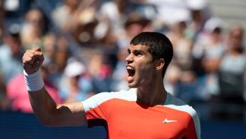 Carlos Alcaraz of Spain gestures as he plays against Sebastian Baez of Argentina during their 2022 US Open Tennis tournament men's singles first round match at the USTA Billie Jean King National Tennis Center in New York, on August 30, 2022. (Photo by KENA BETANCUR / AFP)