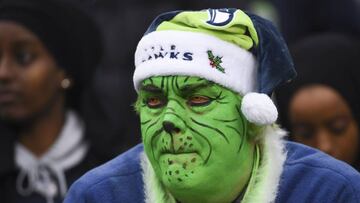 SEATTLE, WA - DECEMBER 17: A Seahawks fan in Grinch makeup watches the game during the third quarter against the Los Angeles Rams at CenturyLink Field on December 17, 2017 in Seattle, Washington. Steve Dykes/Getty Images/AFP
== FOR NEWSPAPERS, INTERNET, TELCOS & TELEVISION USE ONLY ==