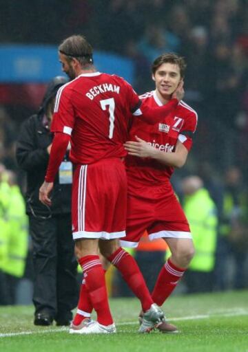 David Beckham y su hijo Brooklyn.