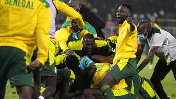 Senegal&#039;s captain Kalidou Koulibaly, middle, with teammates celebrates after winning the African Cup of Nations 2022 final soccer match against Egypt at the Olembe stadium in Yaounde, Cameroon, Sunday, Feb. 6, 2022. (AP Photo/Themba Hadebe)