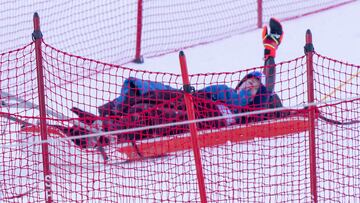 Nov 30, 2024; Killington, Vermont, USA; Mikaela Shiffrin of the United States waves to the crowd as she is taken off the course on a sled in the second run of the women's giant slalom at the Stifel Killington Cup alpine skiing race at Killington Resort. Mandatory Credit: Marc DesRosiers-Imagn Images