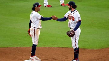 ATLANTA, GEORGIA - OCTOBER 30: Dansby Swanson #7 and Ozzie Albies #1 of the Atlanta Braves celebrates the team's 3-2 win against the Houston Astros in Game Four of the World Series at Truist Park on October 30, 2021 in Atlanta, Georgia. Todd Kirkla