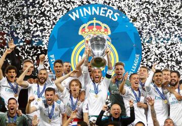 Real Madrid's Sergio Ramos lifts the trophy as Los Blancos celebrate winning the Champions League.