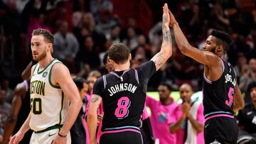 Jan 10, 2019; Miami, FL, USA; Miami Heat guard Tyler Johnson (8) celebrates with forward Derrick Jones Jr. (5) after making a three point shot against the Boston Celtics during the second half at American Airlines Arena. Mandatory Credit: Jasen Vinlove-USA TODAY Sports