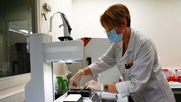 FILE PHOTO: A technician works with an assist plus pipeting robot containing test tubes with samples of the coronavirus disease (COVID-19) at Laboratoire Clement laboratory in Le Blanc Mesnil near Paris, France, September 22, 2020. REUTERS/Gonzalo Fuentes/File Photo