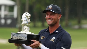 Golf - LIV Golf - Singapore - Sentosa Golf Club, Singapore - March 15, 2026 Crushers GC's Bryson DeChambeau celebrates with his trophy after winning the LIV Golf Singapore REUTERS/Edgar Su