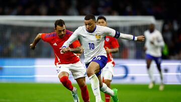 Soccer Football - International Friendly - France v Chile - Stade Velodrome, Marseille, France - March 26, 2024 France's Kylian Mbappe in action with Chile's Gabriel Suazo REUTERS/Sarah Meyssonnier