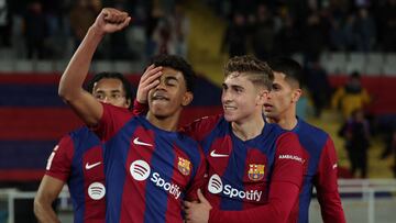 Barcelona's Spanish forward #27 Lamine Yamal (2nd L) celebrates with teammates after scoring his team's first goal during the Spanish league football match between FC Barcelona and RCD Mallorca at the Estadi Olimpic Lluis Companys in Barcelona on March 8, 2024. (Photo by LLUIS GENE / AFP)
