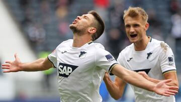 Hoffenheim's Croatian forward Andrej Kramaric (L) celebrates after scoring a goal with Hoffenheim's Austrian defender Stefan Posch during the German first division Bundesliga football match between Eintracht Frankfurt and TSG 1899 Hoffenheim in