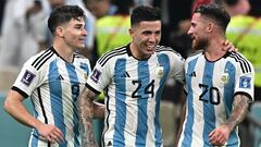 Argentina's forward #09 Julian Alvarez (L) celebrates with Argentina's midfielder #24 Enzo Fernandez (C) and Argentina's midfielder #20 Alexis Mac Allister after he scored his team's second goal during the Qatar 2022 World Cup football semi-final match between Argentina and Croatia at Lusail Stadium in Lusail, north of Doha on December 13, 2022. (Photo by Anne-Christine POUJOULAT / AFP)