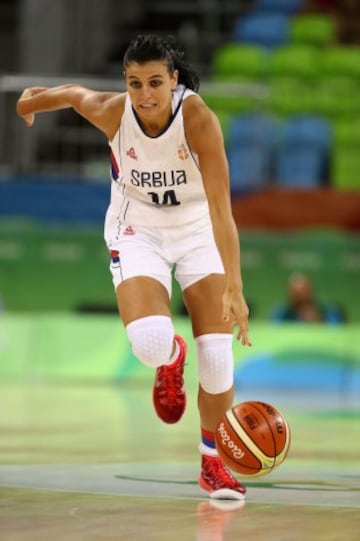 RIO DE JANEIRO, BRAZIL - AUGUST 07: Ana Dabovic #14 of Serbia dribbles upcourt against Spain during a Women's Basketball preliminary round game on Day 2 of the Rio 2016 Olympic Games on July 26, 2016 in Rio de Janeiro, Brazil.  