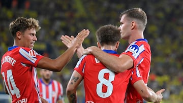 Atletico Madrid's Norwegian forward #09 Alexander Sorloth (R) celebrates scoring an equalizing goal with Atletico Madrid's Spanish midfielder #14 Marcos Llorente (L) during the Spanish league football match between Villarreal CF and Club Atletico de Madrid at La Ceramica stadium in Vila-real on August 19, 2024. (Photo by JOSE JORDAN / AFP)