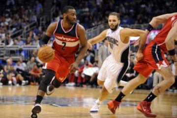 Oct 30, 2014; Orlando, FL, USA; Washington Wizards guard John Wall (2) drives the lane in front of Orlando Magic guard Evan Fournier (10) as the Wizards beat the Magic 105-98 at Amway Center. Mandatory Credit: David Manning-USA TODAY Sports