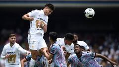 Pumas's Juan Dinenno (top) heads the ball to score against Pachuca during their Mexican Clausura football tournament match at the University Olympic stadium in Mexico City on May 1, 2022. (Photo by Claudio CRUZ / AFP) (Photo by CLAUDIO CRUZ/AFP via Getty Images)