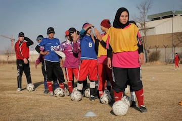 The team’s players wear an assortment of gear, and some do without head scarves, seeing them as a hazard during play.