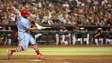 Albert Pujols of the St. Louis Cardinals hits a single against the Arizona Diamondbacks during the seventh inning of the MLB game at Chase Field on August 20, 2022 in Phoenix, Arizona.