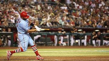 Albert Pujols of the St. Louis Cardinals hits a single against the Arizona Diamondbacks during the seventh inning of the MLB game at Chase Field on August 20, 2022 in Phoenix, Arizona.