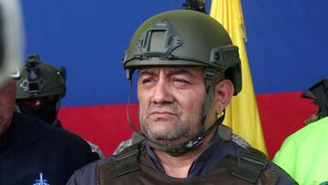 FILE PHOTO: Colombian drug trafficker Dairo Antonio Usuga David, also known as "Otoniel", is pictured as he gets escorted by police officers after Colombia extradites him to the United States, in Bogota, Colombia May 4, 2022. Colombia Policia Nacional (PONAL)/Handout via REUTERS ATTENTION EDITORS - THIS IMAGE WAS PROVIDED BY A THIRD PARTY. NO RESALES. NO ARCHIVES/File Photo