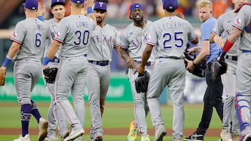 Jose Leclerc, #25 of the Texas Rangers, celebrates with his teammates after defeating the Houston Astros in Game Two of the American League Championship Series