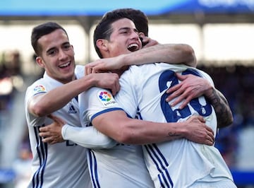 Real Madrid's Colombian midfielder James Rodriguez celebrates with Asensio and Lucas Vazquez in Eibar.