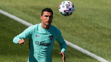 (FILES) In this file photo taken on June 3, 2021 Portugal's forward Cristiano Ronaldo attends a training session at the "Cidade do Futebol" training camp in Oeiras on the eve of the international friendly football match between Spain and Po