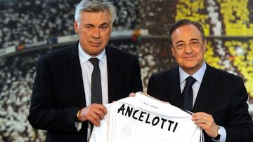 (FILES) In this file photo taken on June 26, 2013 new Real Madrid's Italian coach Carlo Ancelotti (L) poses with his new team's jersey flanked by Real Madrid's president Florentino Perez during his presentation at Santiago Bernabeu stadium,