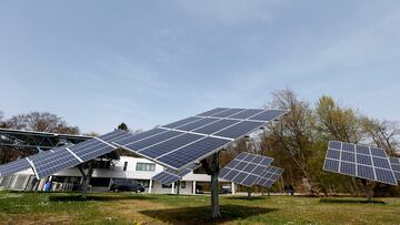FILE PHOTO: Solar panels surround the entrance to the Wacker Chemie AG facility in the south-east Bavarian town of Burghausen April 1, 2014. REUTERS/Michaela Rehle/File Photo