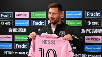 (FILES) Inter Miami's Argentine forward Lionel Messi holds his jersey during a press conference at DRV PNK Stadium in Fort Lauderdale, Florida on August 17, 2023. Lionel Messi has been named on December 5, 2023 Time magazine's "Athlete of the Year" for 2023 after a trailblazing season marked by an eighth Ballon d'Or award and his ground-breaking move to Major League Soccer's Inter Miami. (Photo by CHANDAN KHANNA / AFP)