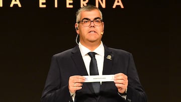 Conmebol's director of club competitions Frederico Nantes shows the slip for Argentina's River Plate during the draw for the round of 16 of the Copa Libertadores and Copa Sudamericana in Luque, Paraguay on July 5, 2023. (Photo by Daniel Piris / AFP)