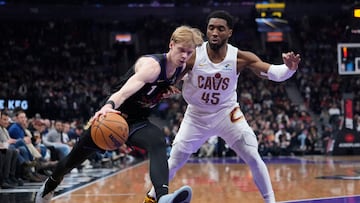 Feb 12, 2025; Toronto, Ontario, CAN; Toronto Raptors guard Gradey Dick (1) drives to the net against Cleveland Cavaliers guard Donovan Mitchell (45) during the first half at Scotiabank Arena. Mandatory Credit: John E. Sokolowski-Imagn Images