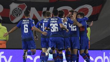 Tigre's forward Mateo Retegui (3-R) celebrates with teammates after scoring a goal against River Plate during an Argentine Professional Football League quarterfinal match at the Monumental stadium in Buenos Aires, on May 11, 2022. (Photo by JUAN MABROMATA / AFP)