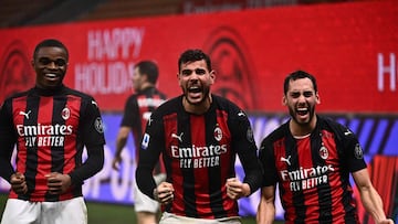 AC Milan's French defender Theo Hernandez (C) celebrates with AC Milan's French defender Pierre Kalulu (L) and AC Milan's Turkish midfielder Hakan Calhanoglu after scoring during the Italian Serie A football match AC Milan vs Lazio Rome on