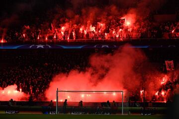 Paris Saint-Germain's supporters burn flares during the game.