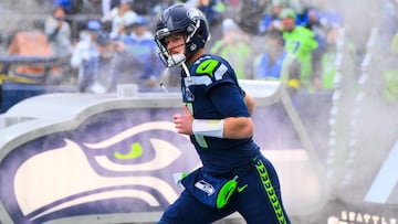 Dec 14, 2025; Seattle, Washington, USA; Seattle Seahawks quarterback Sam Darnold (14) exits the tunnel during player introductions before a game against the Los Angeles Chargers at Lumen Field. Mandatory Credit: Steven Bisig-Imagn Images