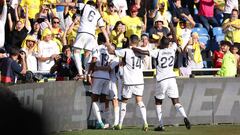 Real Madrid's French defender #18 Aurelien Tchouameni celebrates with teammates after scoring his team's second goal during the Spanish league football match between UD Las Palmas and Real Madrid CF at the Gran Canaria stadium in Las Palmas de Gran Canaria on January 27, 2024. (Photo by Thomas COEX / AFP)