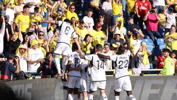 Real Madrid's French defender #18 Aurelien Tchouameni celebrates with teammates after scoring his team's second goal during the Spanish league football match between UD Las Palmas and Real Madrid CF at the Gran Canaria stadium in Las Palmas de Gran Canaria on January 27, 2024. (Photo by Thomas COEX / AFP)